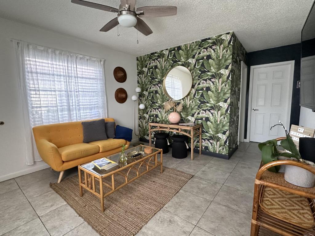 a living room with a couch and a table at Miami's Cozy Tropical Getaway in Miami