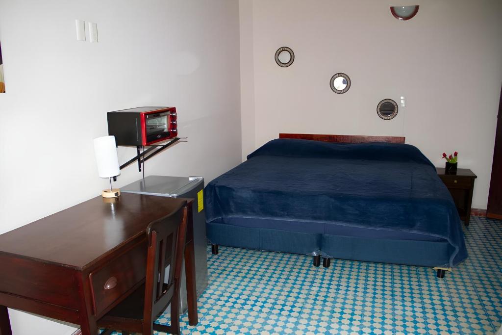 Postel nebo postele na pokoji v ubytování Hotel Cortaza Galería