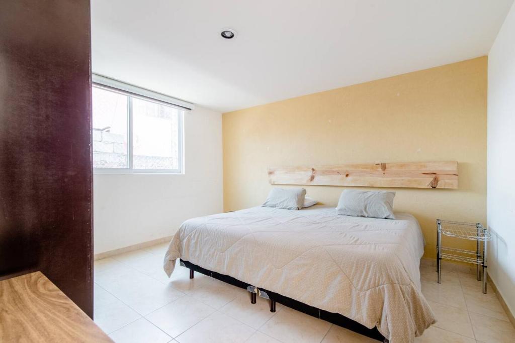 Postel nebo postele na pokoji v ubytování Habitación con Cama King Size en Puebla, Puebla
