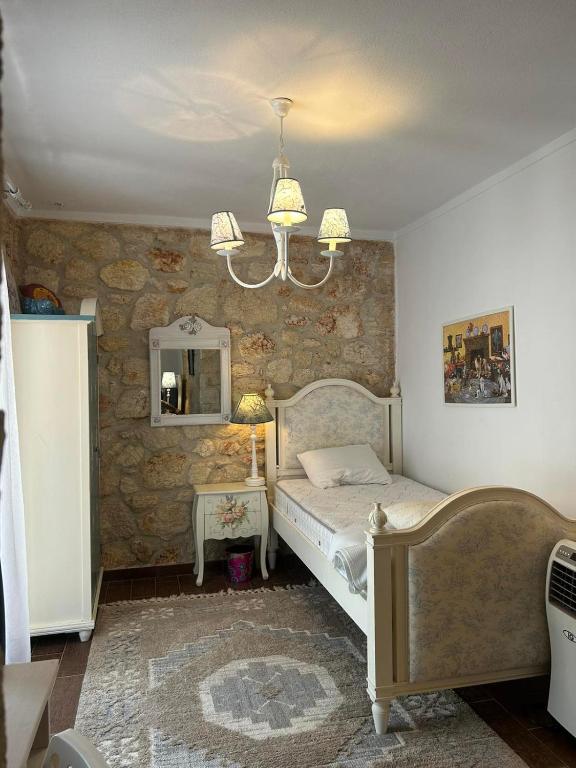 Postel nebo postele na pokoji v ubytování STONE Villa