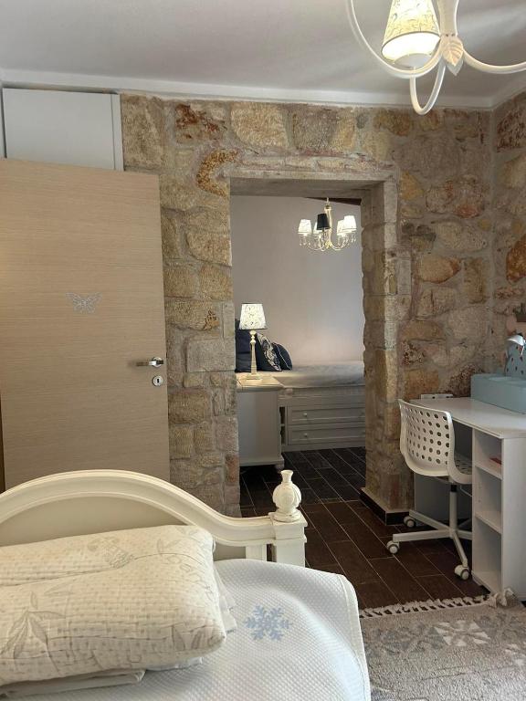 Postel nebo postele na pokoji v ubytování STONE Villa
