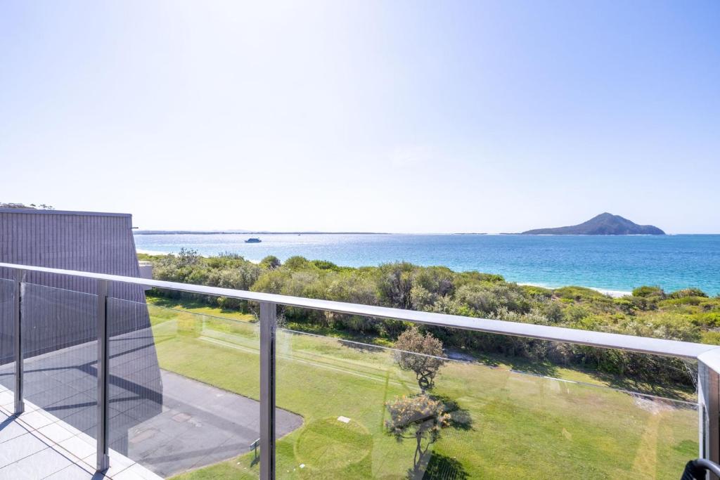 a view of the ocean from the balcony of a house at Luskin Lodge 11 stunning water views in Shoal Bay