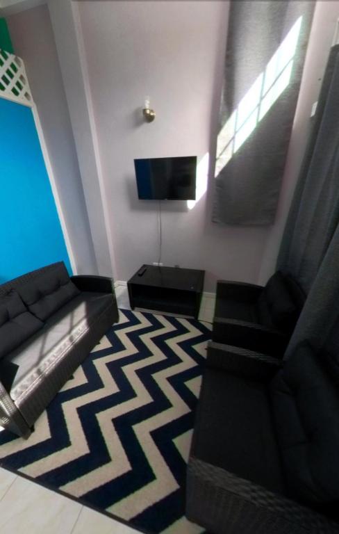 TV a/nebo společenská místnost v ubytování Marie's Beach House