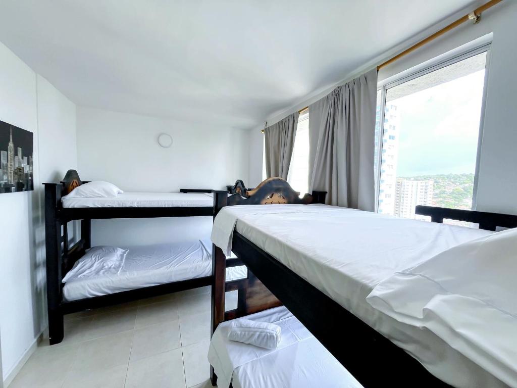 En eller flere senger på et rom på Aqualina 42M2/3 cuadras playa
