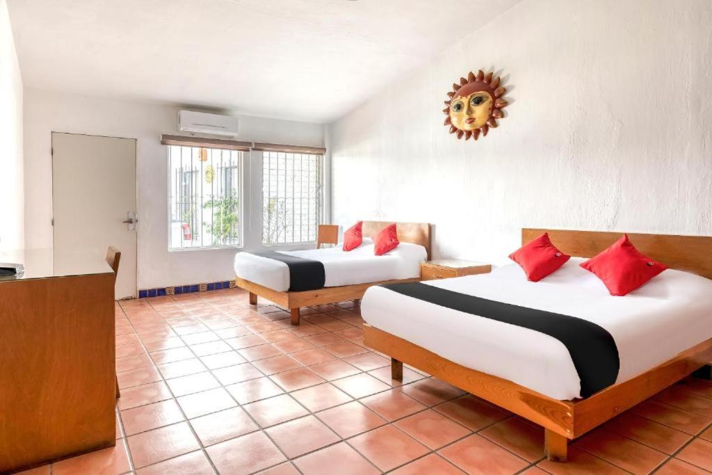 Postel nebo postele na pokoji v ubytování Hotel Arana Tonalá