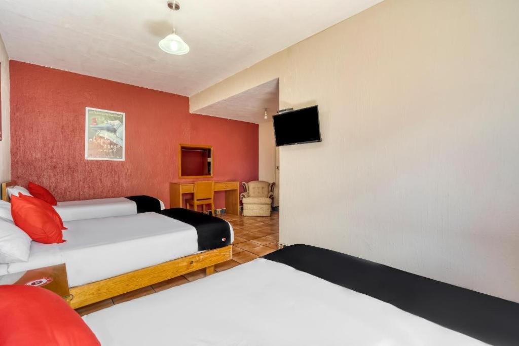 Postel nebo postele na pokoji v ubytování Hotel Arana Tonalá