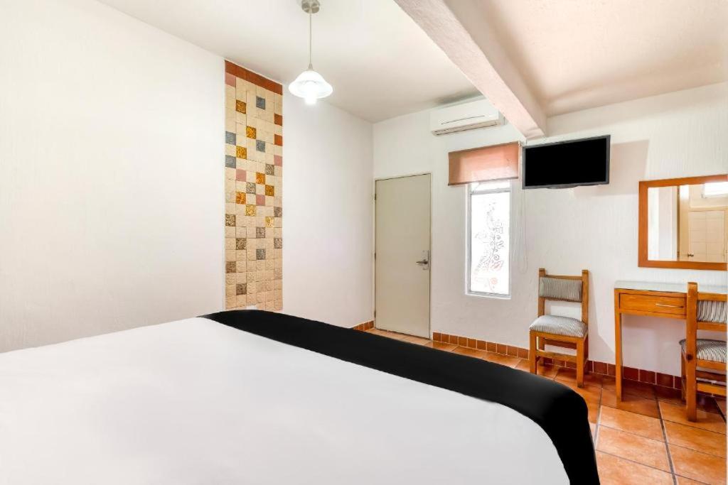 Postel nebo postele na pokoji v ubytování Hotel Arana Tonalá
