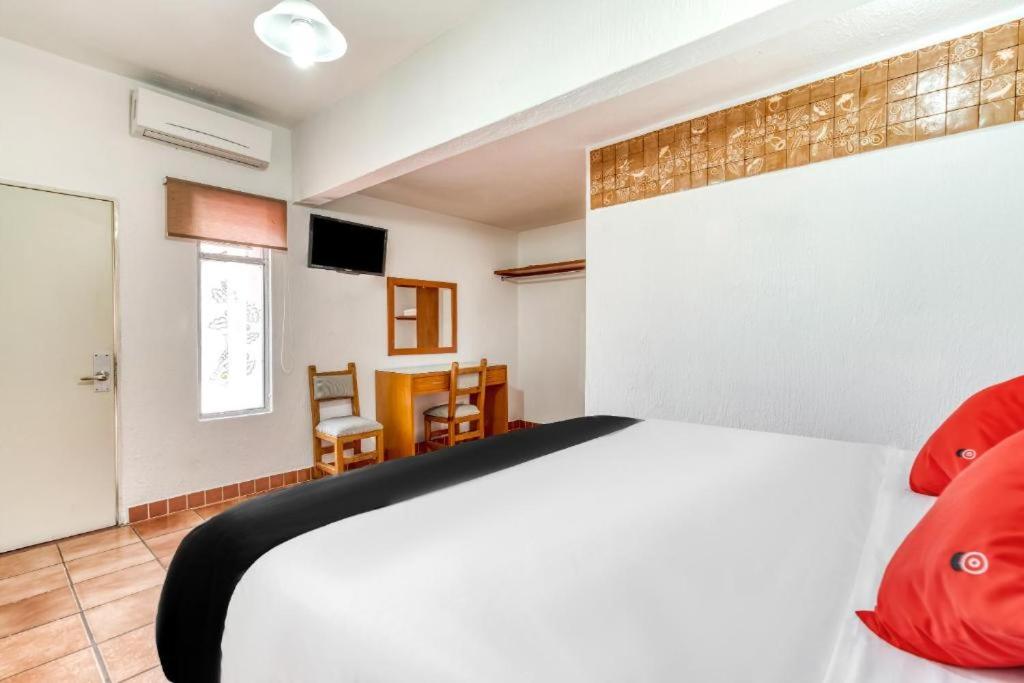 Postel nebo postele na pokoji v ubytování Hotel Arana Tonalá
