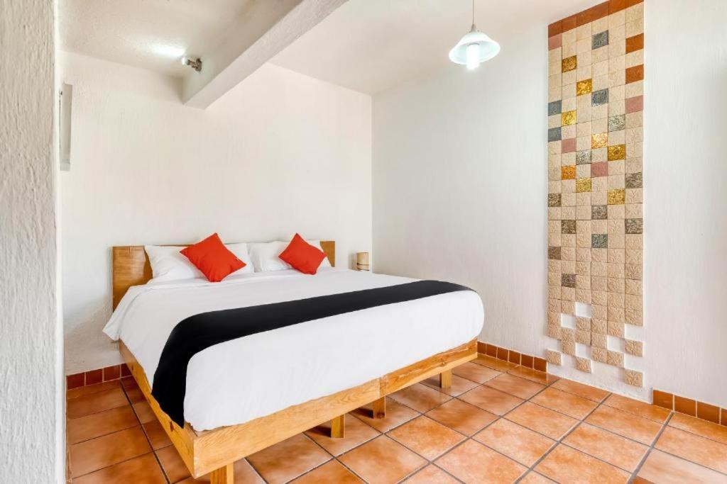 Postel nebo postele na pokoji v ubytování Hotel Arana Tonalá