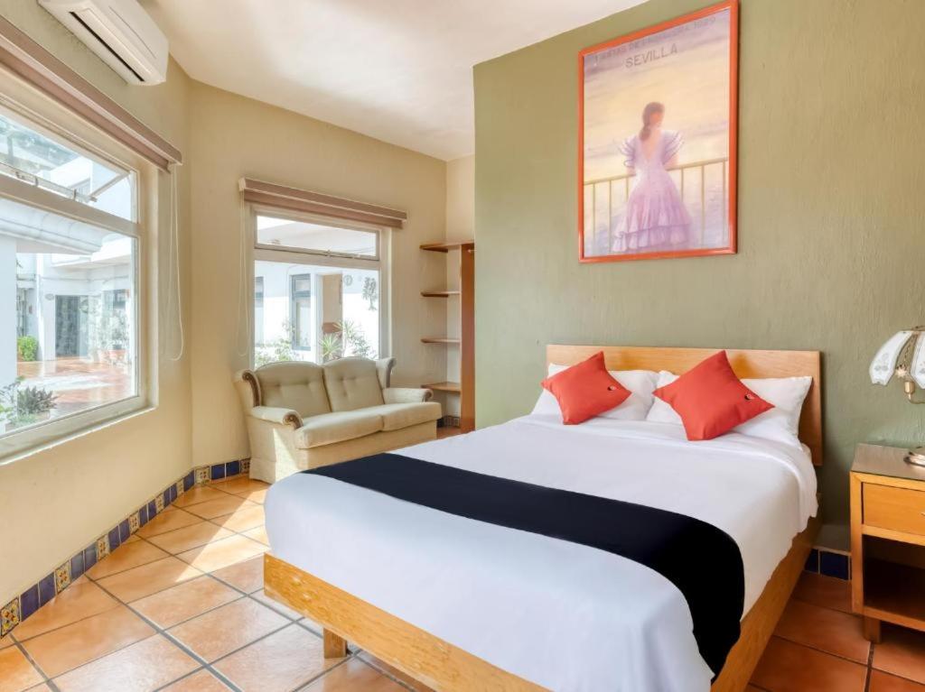 Postel nebo postele na pokoji v ubytování Hotel Arana Tonalá
