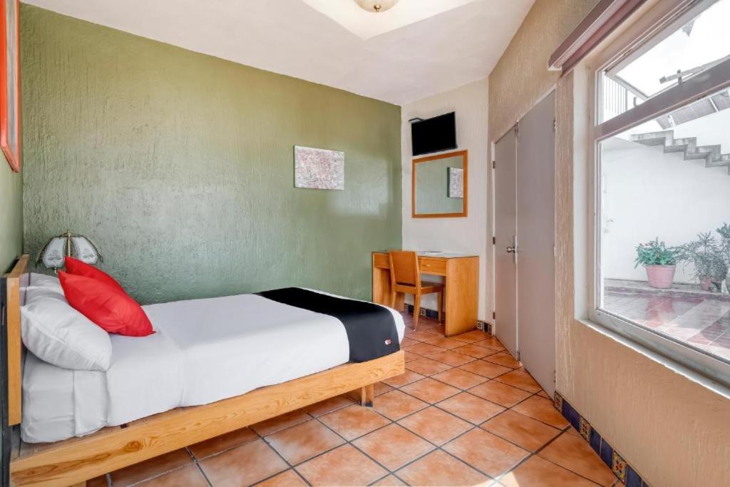 Postel nebo postele na pokoji v ubytování Hotel Arana Tonalá