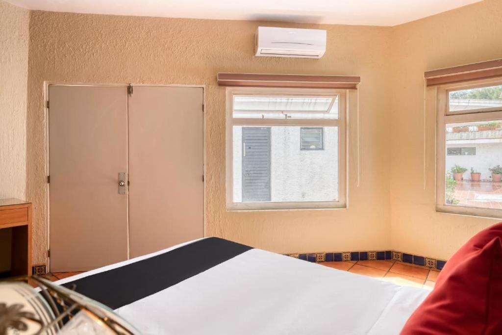 Postel nebo postele na pokoji v ubytování Hotel Arana Tonalá