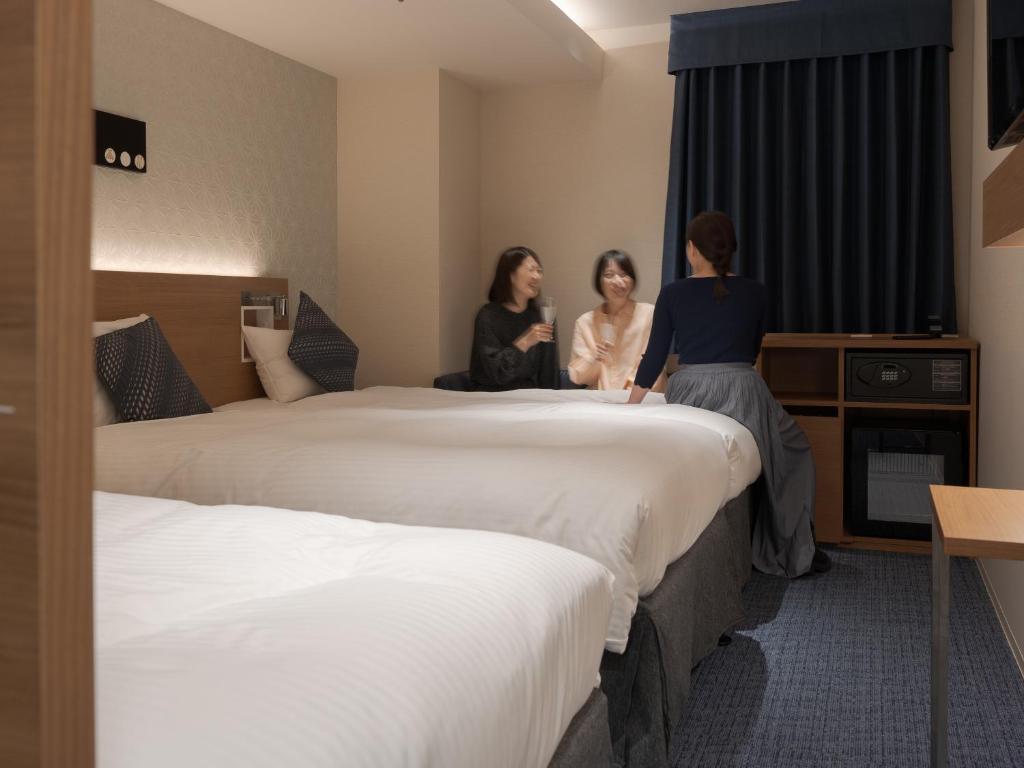 Postel nebo postele na pokoji v ubytování Hotel Vista Nagoya Nishiki