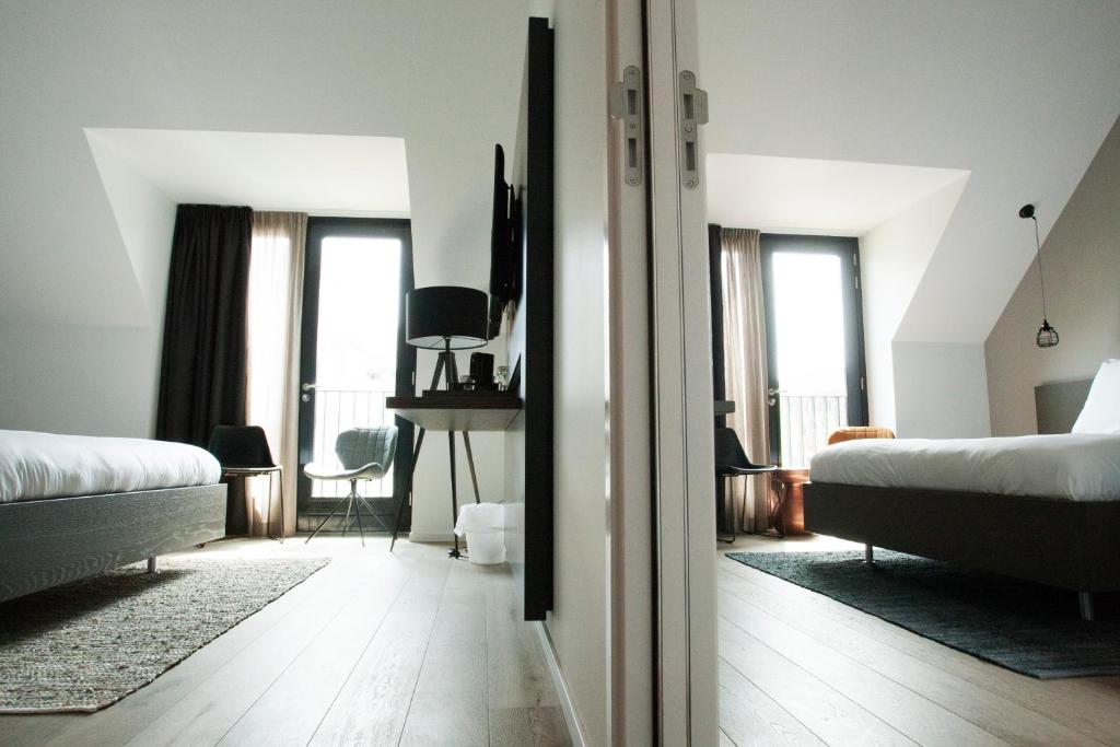 Postel nebo postele na pokoji v ubytování Hotel Katoen