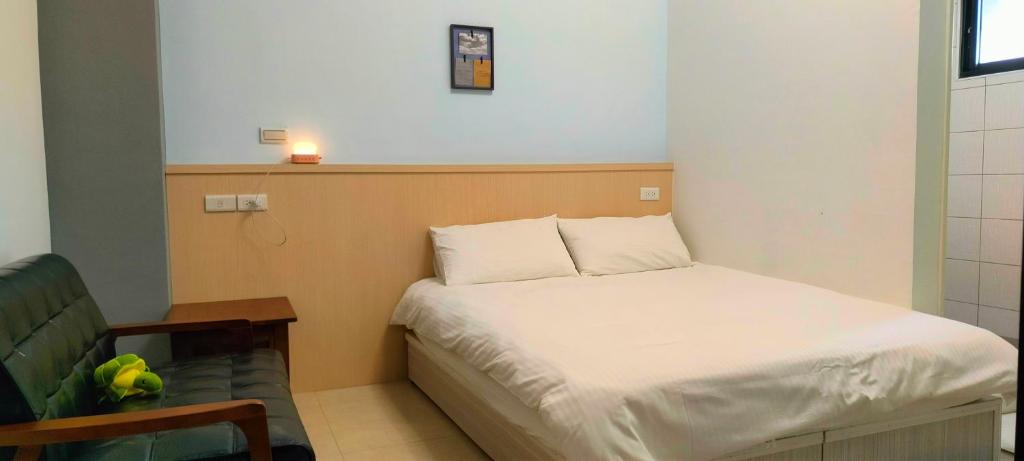 Postel nebo postele na pokoji v ubytování Zhuge Hospitality Homestay