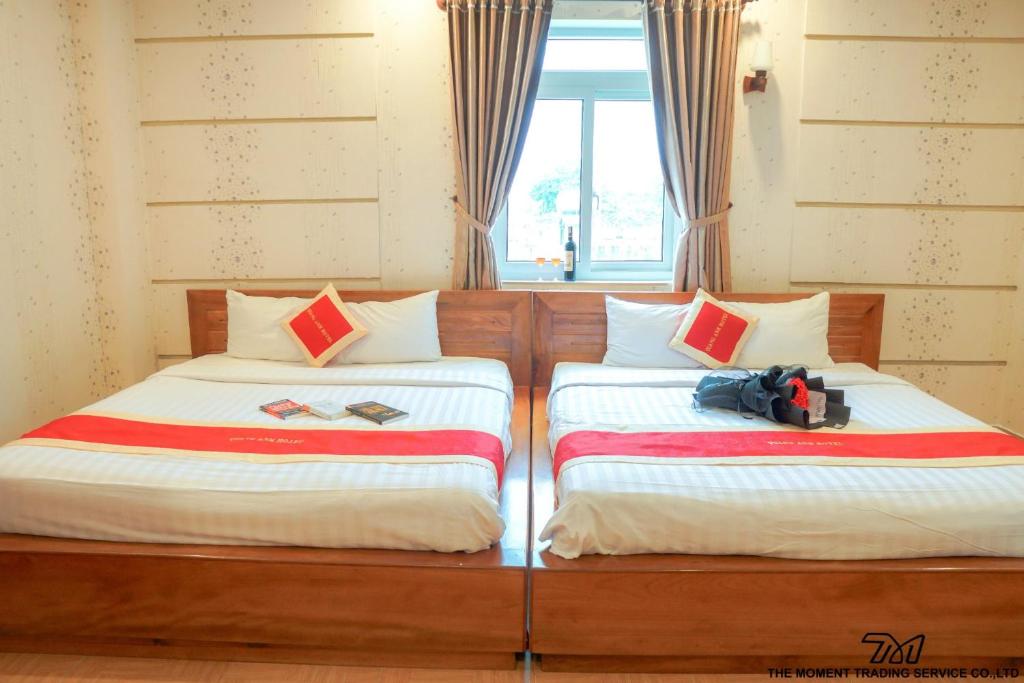 Postel nebo postele na pokoji v ubytování Seika Hotel by The Moment