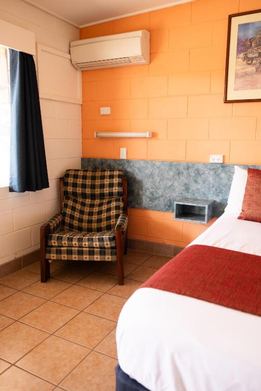 Postel nebo postele na pokoji v ubytování Wagon Wheel Motel