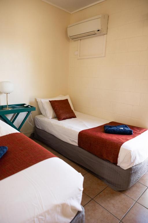 Postel nebo postele na pokoji v ubytování Wagon Wheel Motel