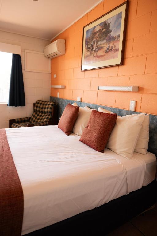 Postel nebo postele na pokoji v ubytování Wagon Wheel Motel