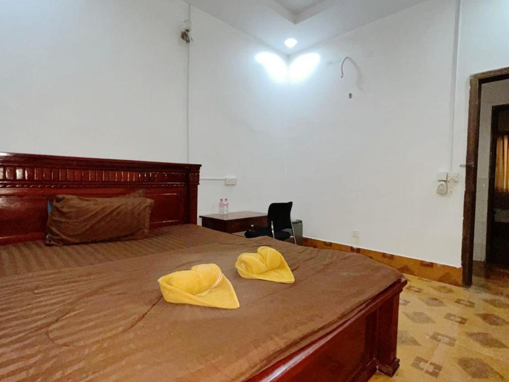 Postel nebo postele na pokoji v ubytování Takeo Guesthouse