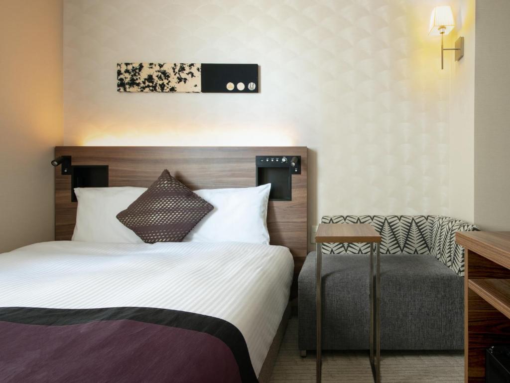 Postel nebo postele na pokoji v ubytování Hotel Vista Nagoya Nishiki