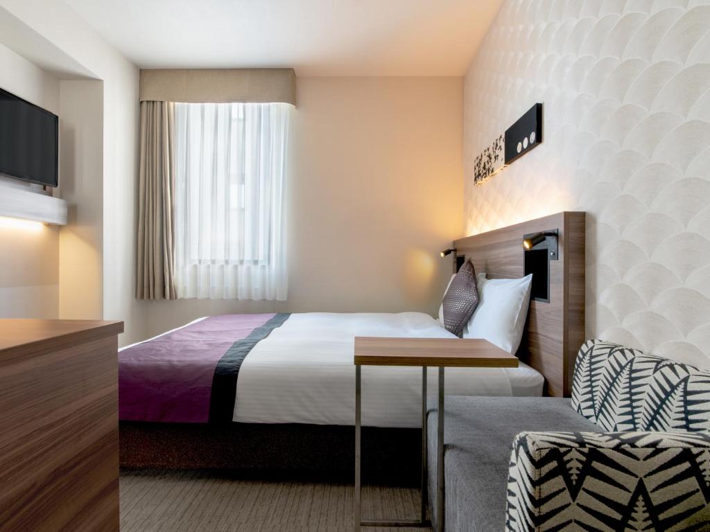 Postel nebo postele na pokoji v ubytování Hotel Vista Nagoya Nishiki