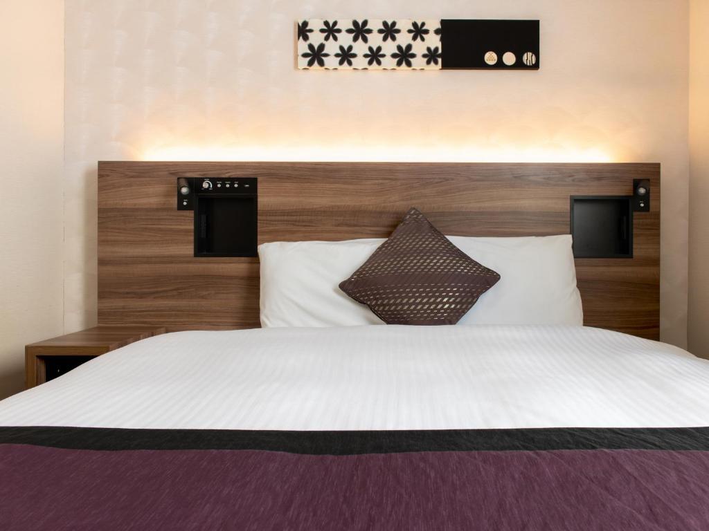 Postel nebo postele na pokoji v ubytování Hotel Vista Nagoya Nishiki