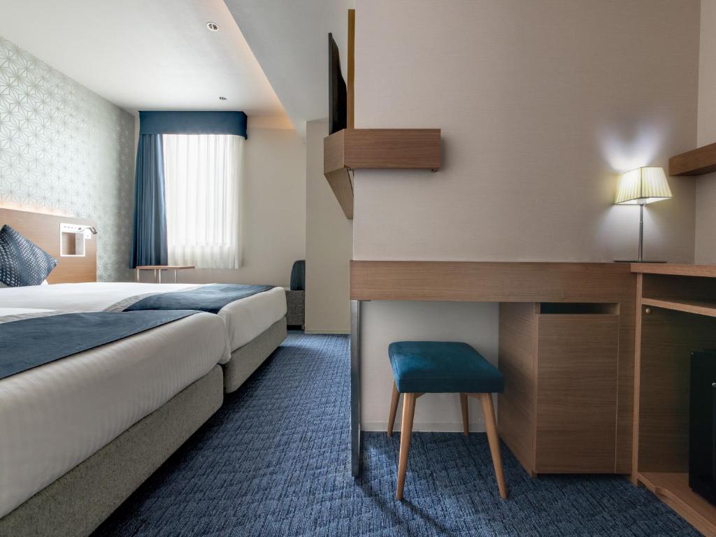 Postel nebo postele na pokoji v ubytování Hotel Vista Nagoya Nishiki