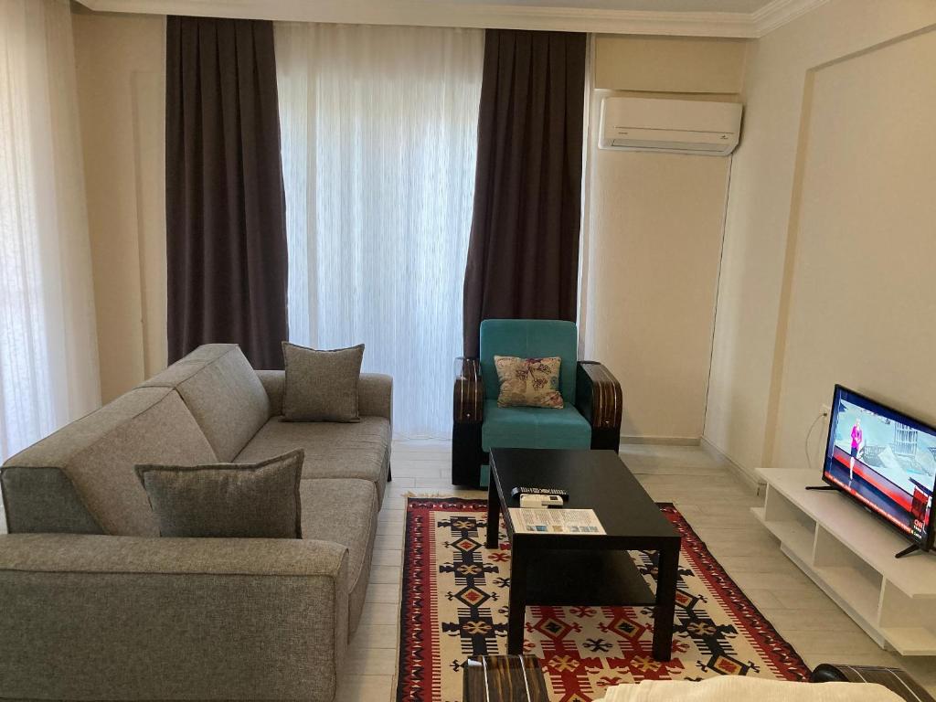 TV a/nebo společenská místnost v ubytování Dalaman Pansiyon & Family rooms