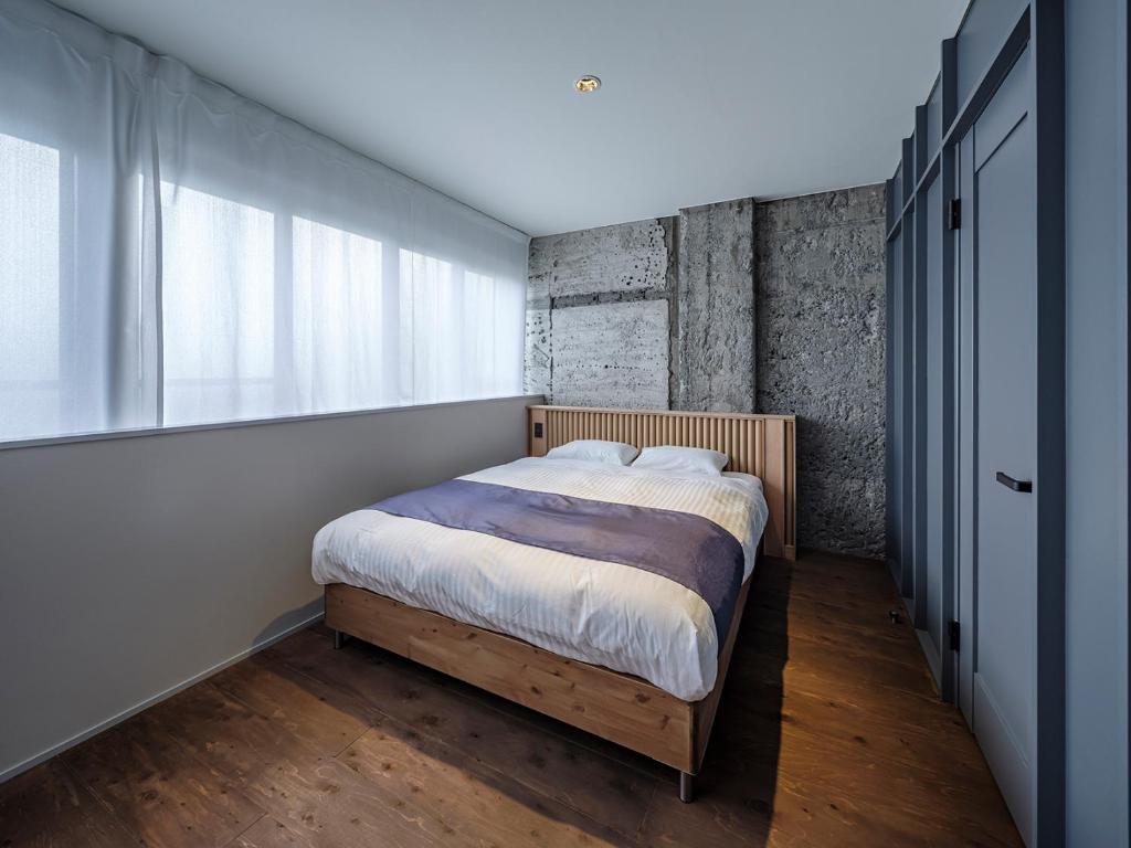 Postel nebo postele na pokoji v ubytování Arcade Hotel