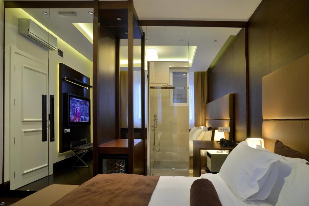 Postel nebo postele na pokoji v ubytování Belgreat Premium Suites