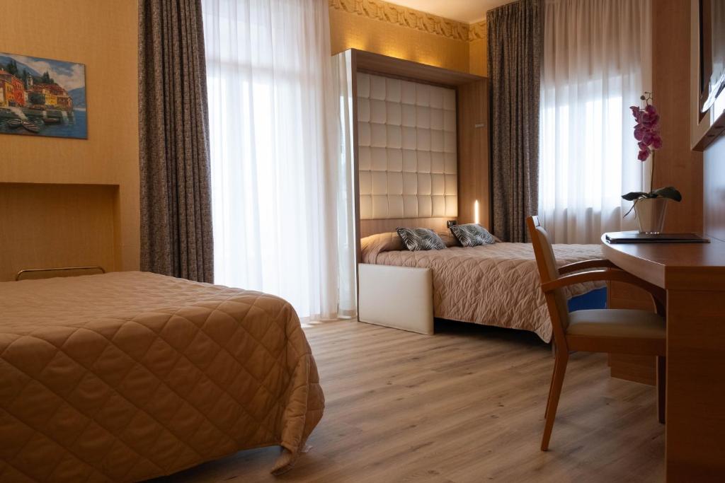 Postel nebo postele na pokoji v ubytování Hotel Vela D'oro ***S