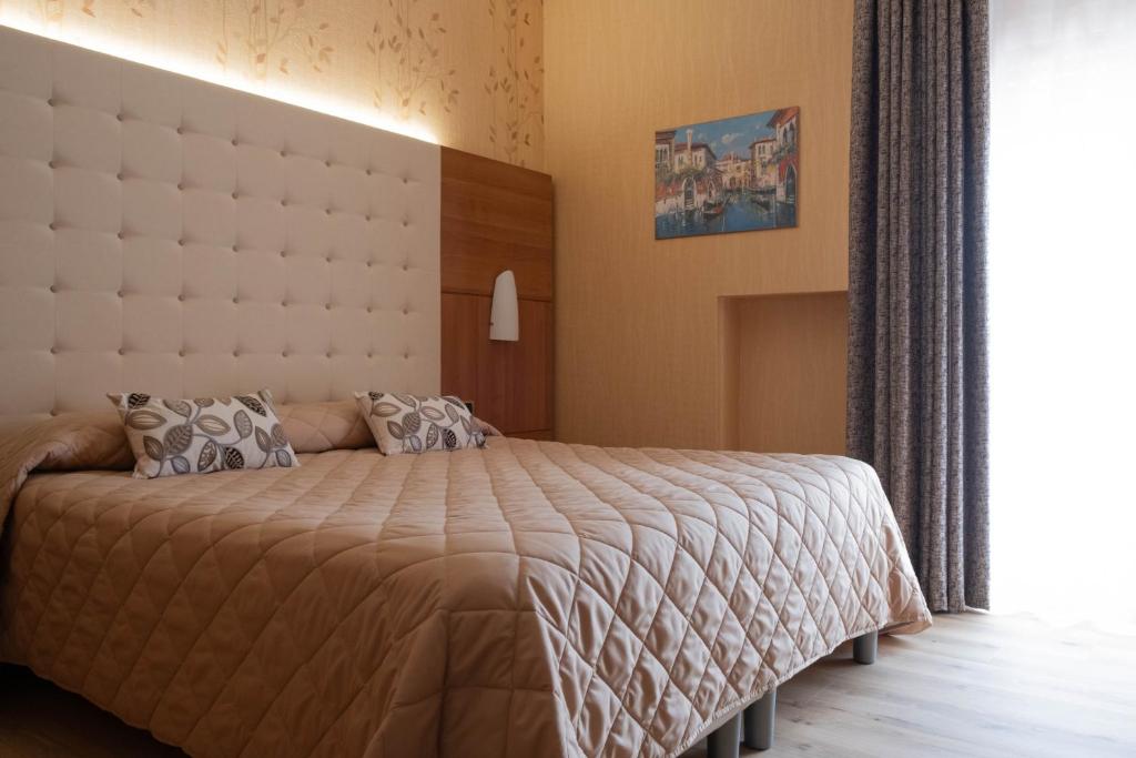 Postel nebo postele na pokoji v ubytování Hotel Vela D'oro ***S
