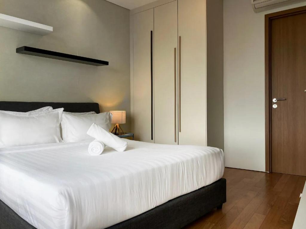 Postel nebo postele na pokoji v ubytování Stella Maison KLCC