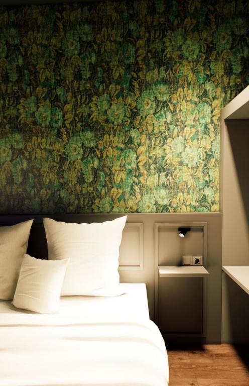 Postel nebo postele na pokoji v ubytování Hotel Central