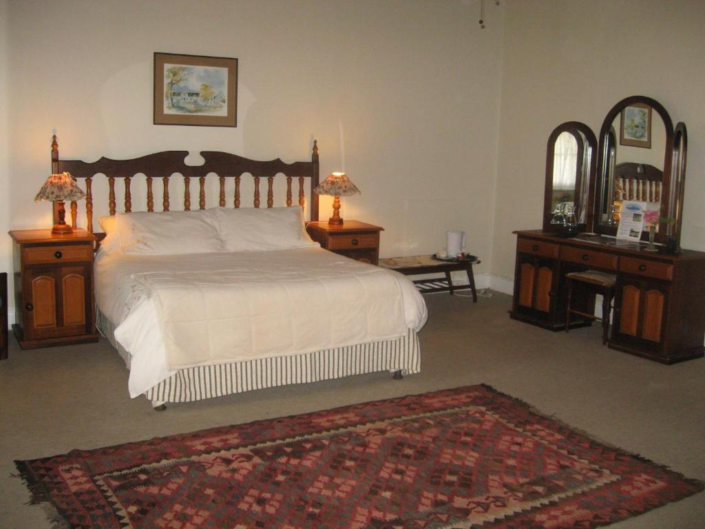 
A bed or beds in a room at Sleeping Beauty Guesthouse
