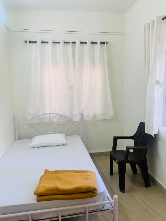 Postel nebo postele na pokoji v ubytování Palolem Paradise Guest House