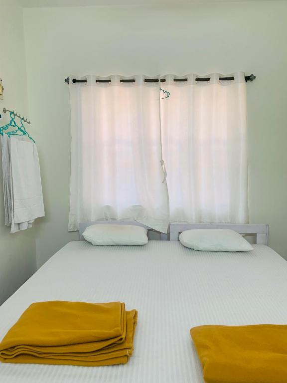Postel nebo postele na pokoji v ubytování Palolem Paradise Guest House
