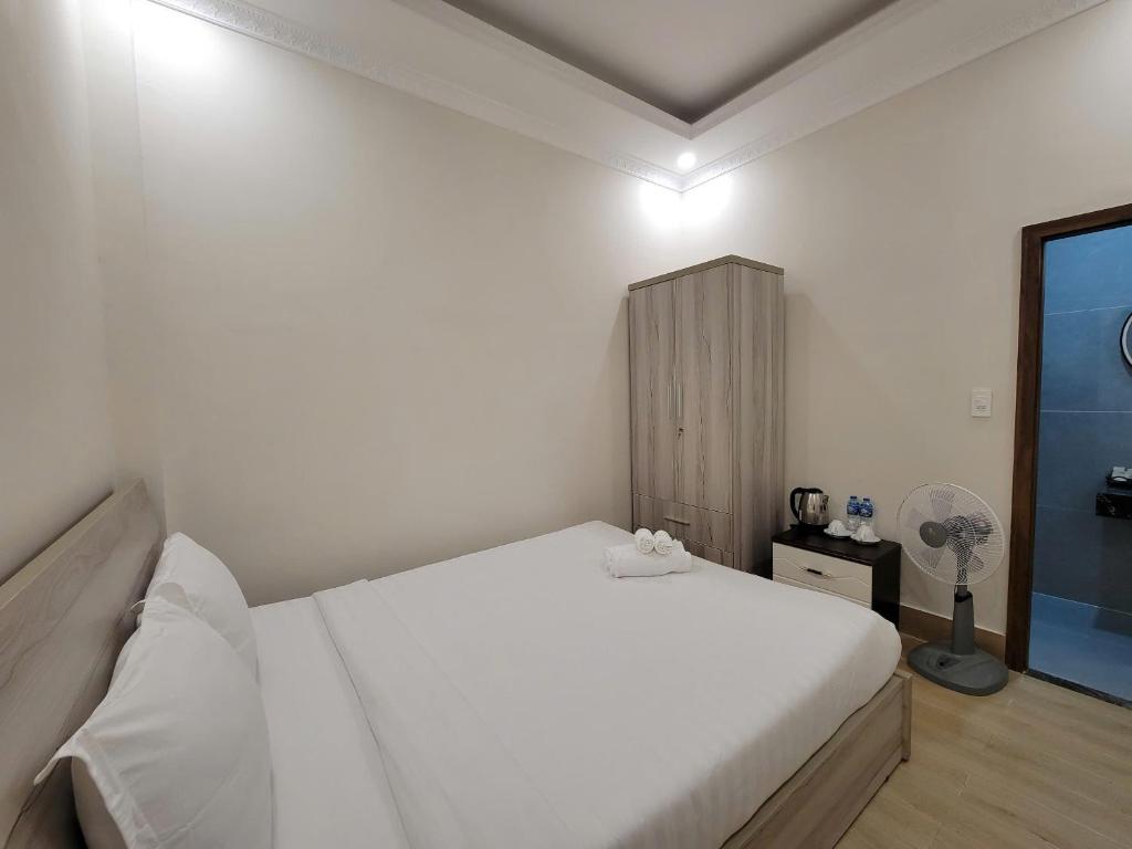 Postel nebo postele na pokoji v ubytování Savio Hotel Trieu Viet Vuong