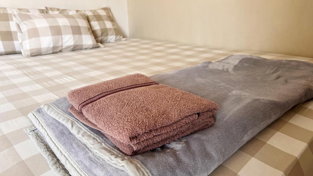 Ένα ή περισσότερα κρεβάτια σε δωμάτιο στο Moona Homestay