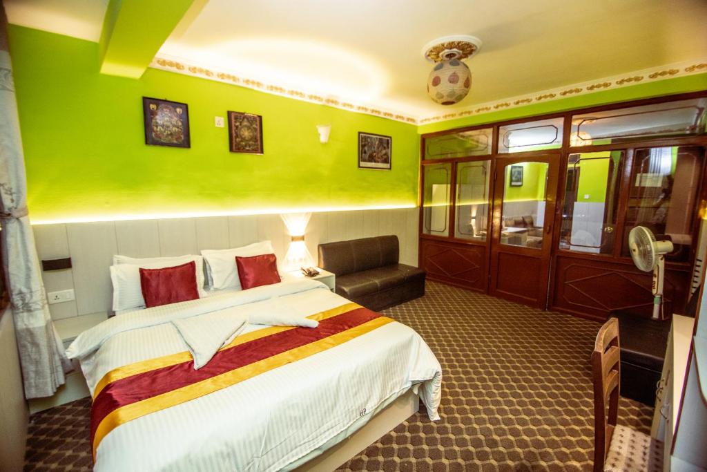 Postel nebo postele na pokoji v ubytování Hotel Pomelo House Inn