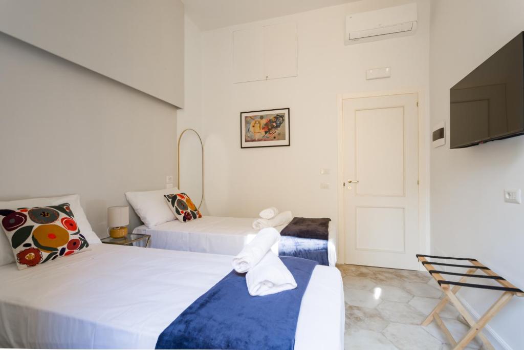 Postel nebo postele na pokoji v ubytování Casa Mancini B&B