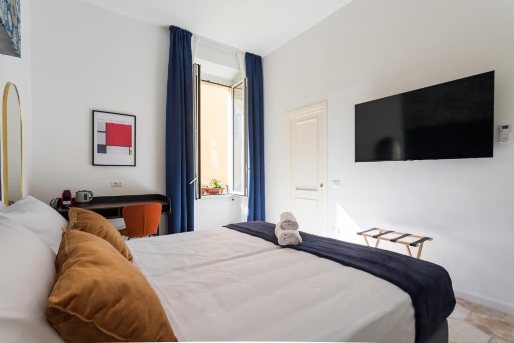 Postel nebo postele na pokoji v ubytování Casa Mancini B&B