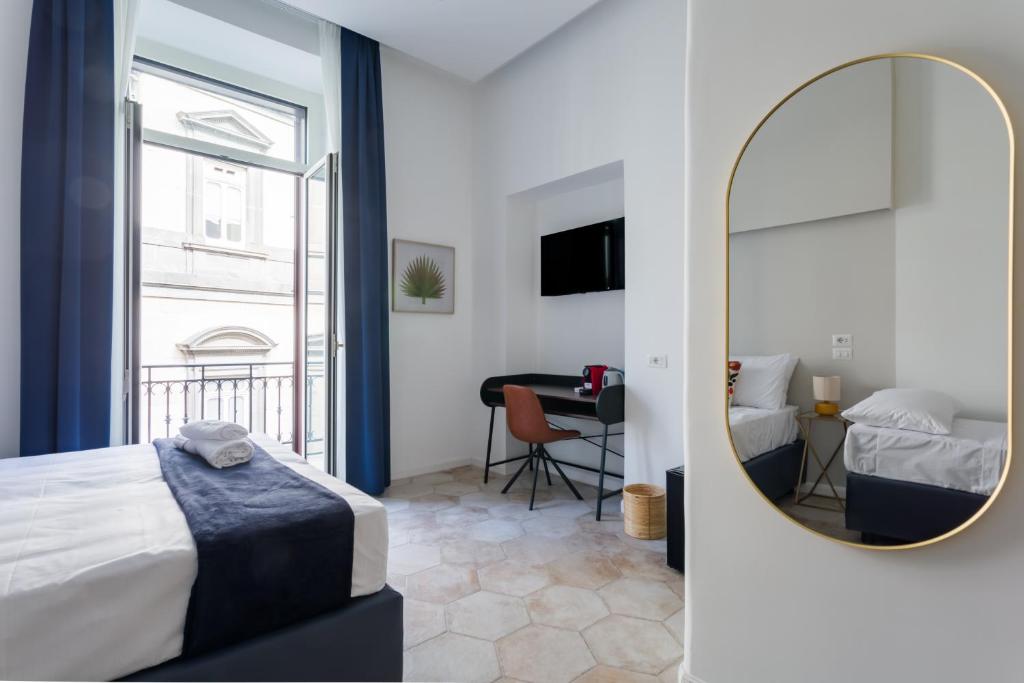 Postel nebo postele na pokoji v ubytování Casa Mancini B&B