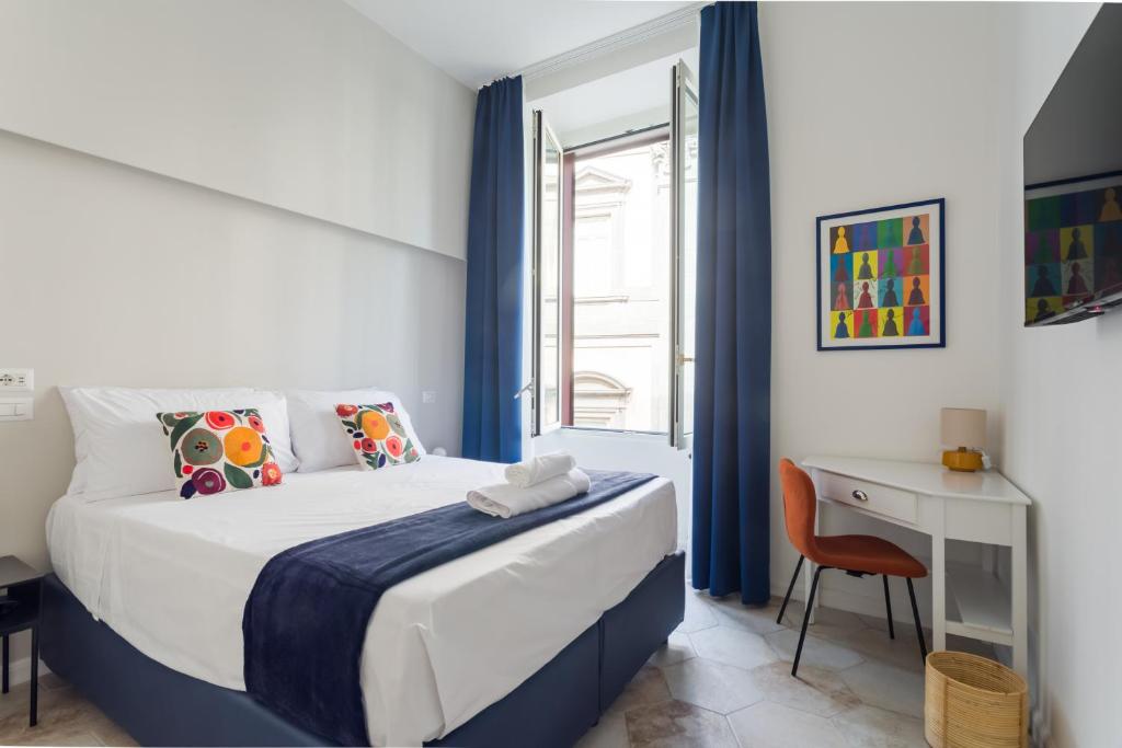 Postel nebo postele na pokoji v ubytování Casa Mancini B&B