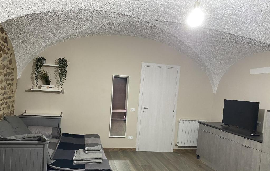 TV a/nebo společenská místnost v ubytování Appartamento B&B C'era una volta