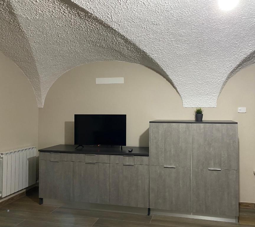 TV a/nebo společenská místnost v ubytování Appartamento B&B C'era una volta