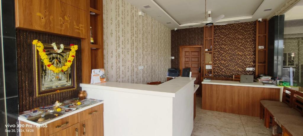 a room with a counter and aasteryasteryasteryasteryasteryasteryasteryasteryastery at Sgr Luxury Homes in Kammasandra