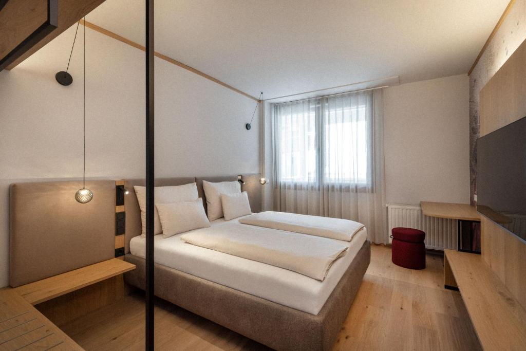 Postel nebo postele na pokoji v ubytování Heilthermen Resort Bad Waltersdorf