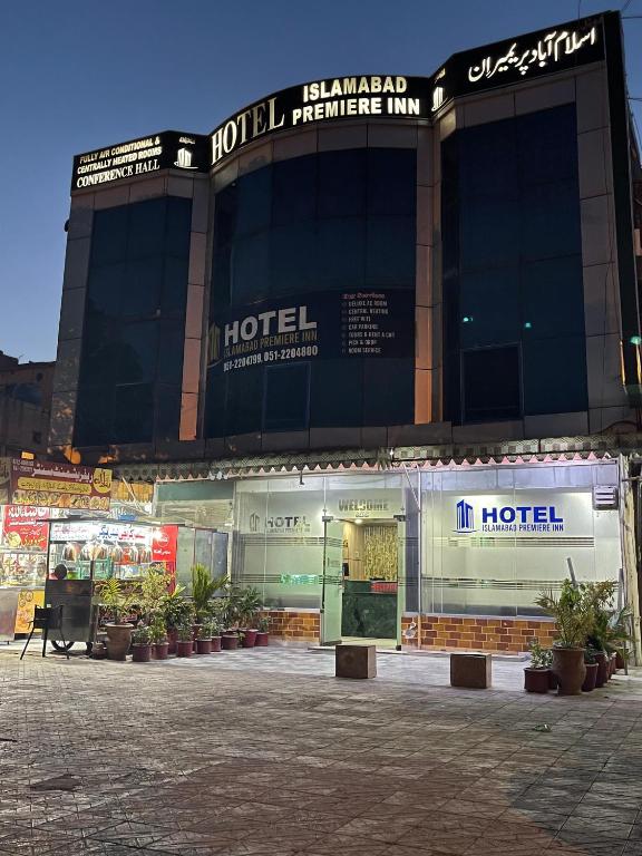 a large building with a hotel in front of it at Hotel Islamabad Premiere Inn in Islamabad